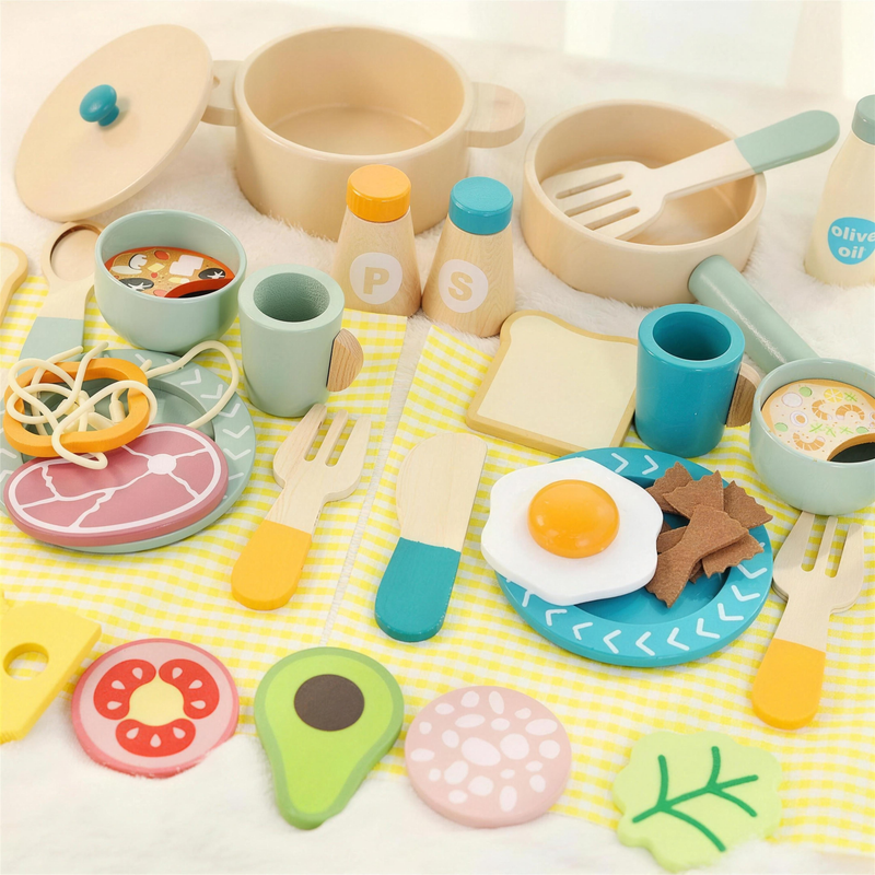 Wooden cooking set laid out on yellow checkered place mats