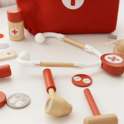 Wooden stethoscope, thermometer and reflex hammer close up