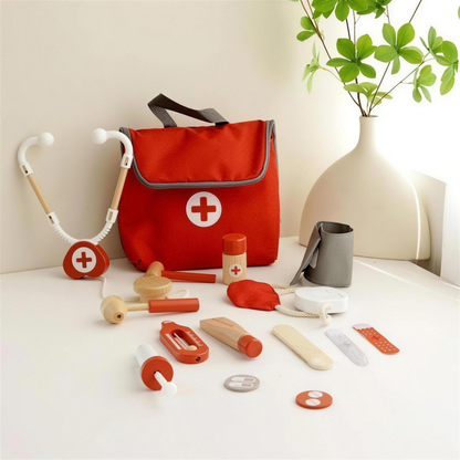 Doctor kit bag with stethoscope and tools laid out on a table