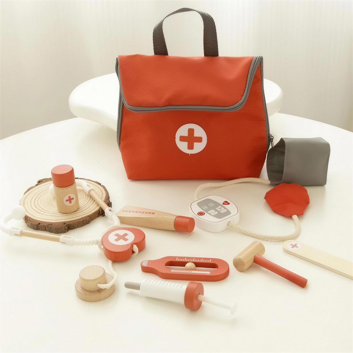 Doctor kit bag with syringe, blood pressure cuff and wooden tools