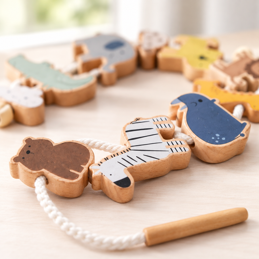 Close-up of wooden animal threading pieces