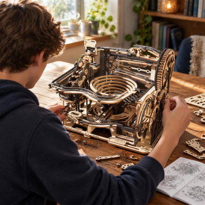 Teen building the marble run kit