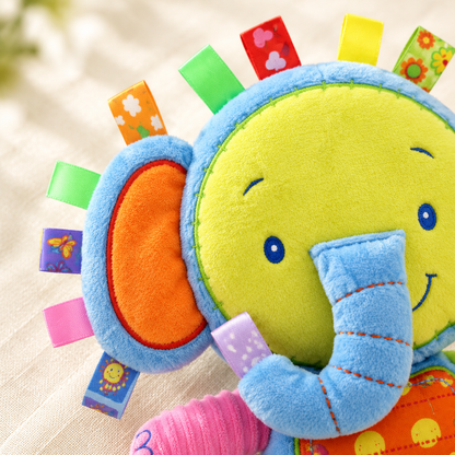 Close-up of the colorful tags on the elephant tag plush